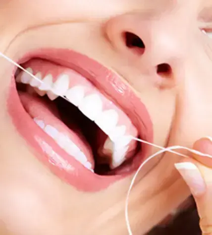 Flossing demonstrated as part of gum disease therapy